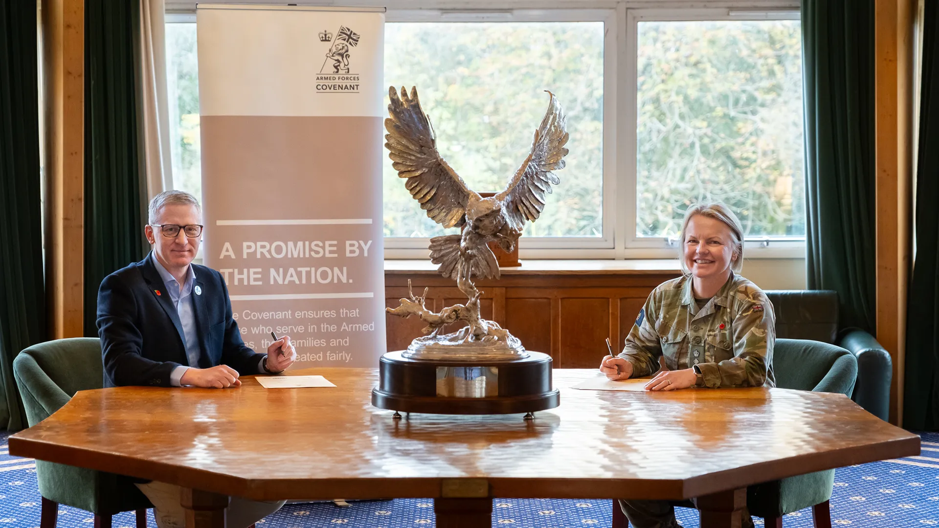 Turnbull Managing Director James Dryden and Colonel Becky Jacques-Grey signing the Armed Covenant